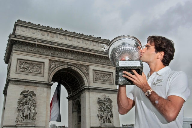 Swiss Roger Federer kisses his trophy on
